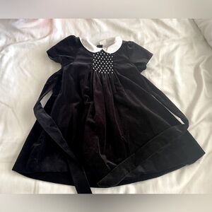 Beautiful black velvet smocked dress with seed pearl embroidery